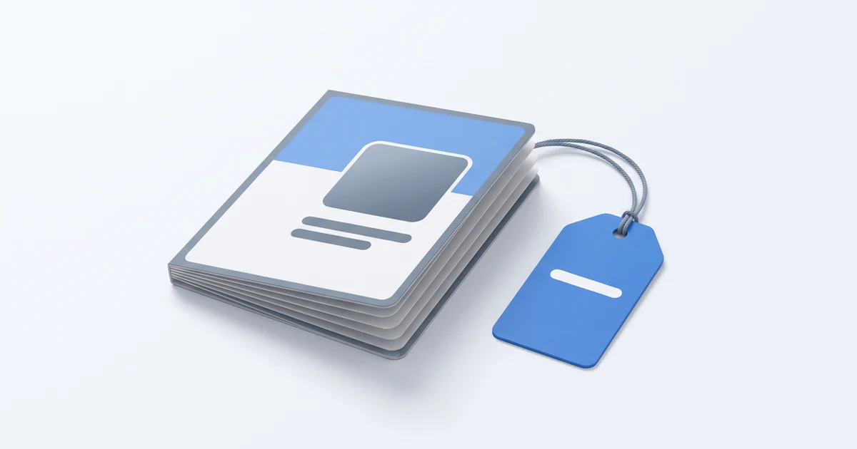 A short booklet lies on a light surface with a blank blue tag tied to its corner.